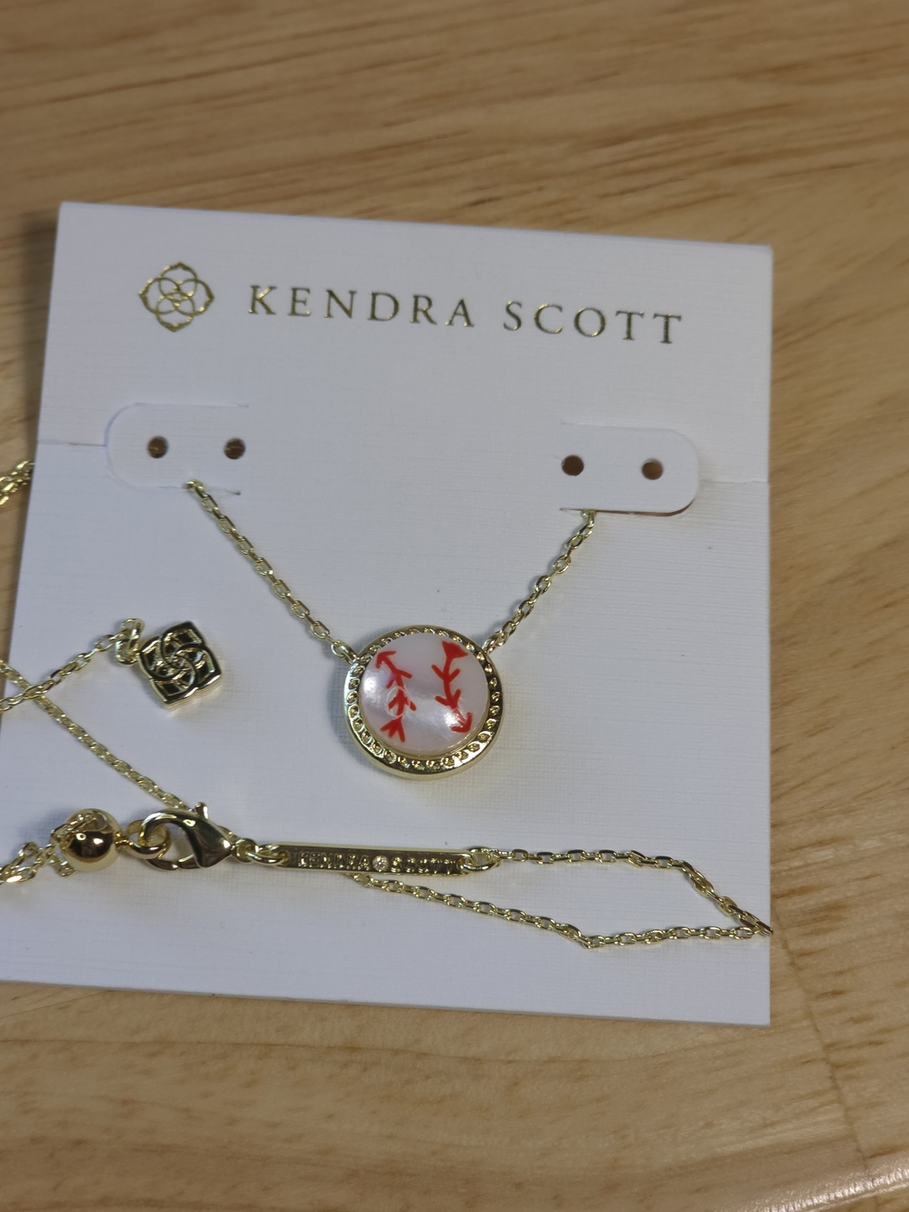 Kendra Scott Gold Necklace with White Pendant and Red Stitching